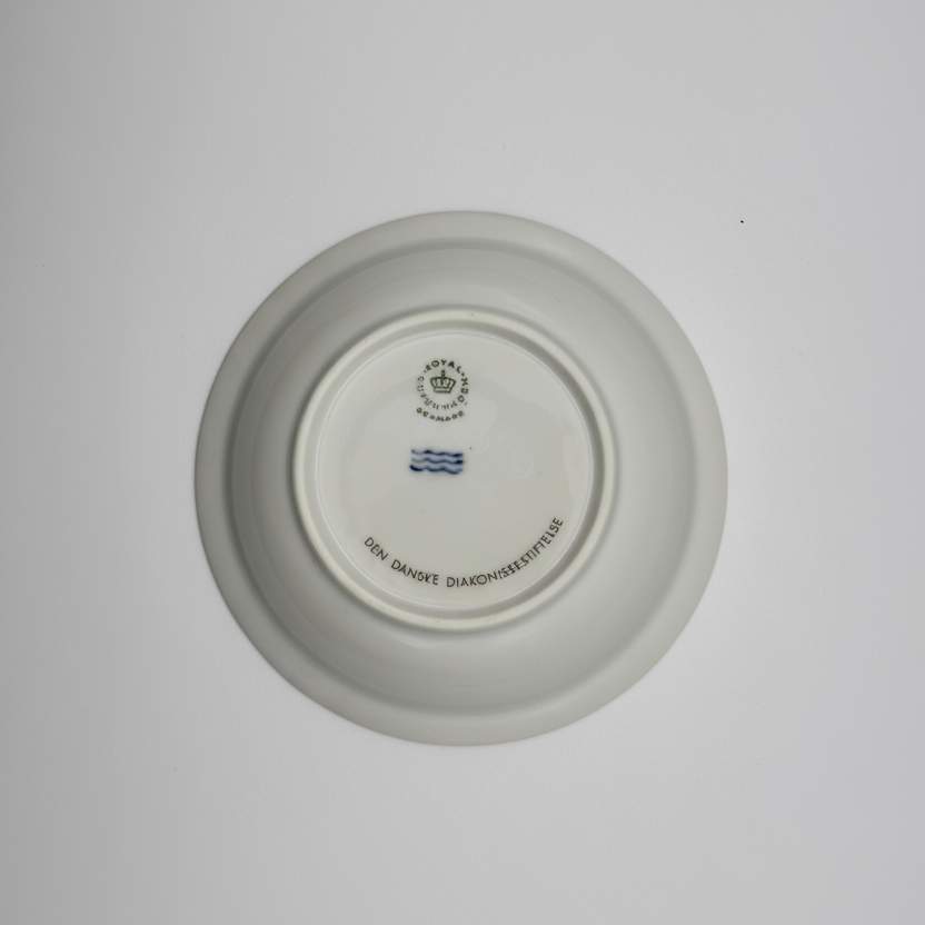 Royal Copenhagen plate underside showing crown logo, three waves, and DENMARK mark