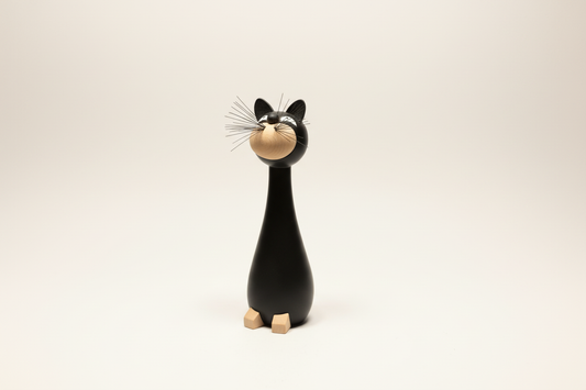 Gunnar Flørning black cat figurine, side view showing elongated form and metal whiskers